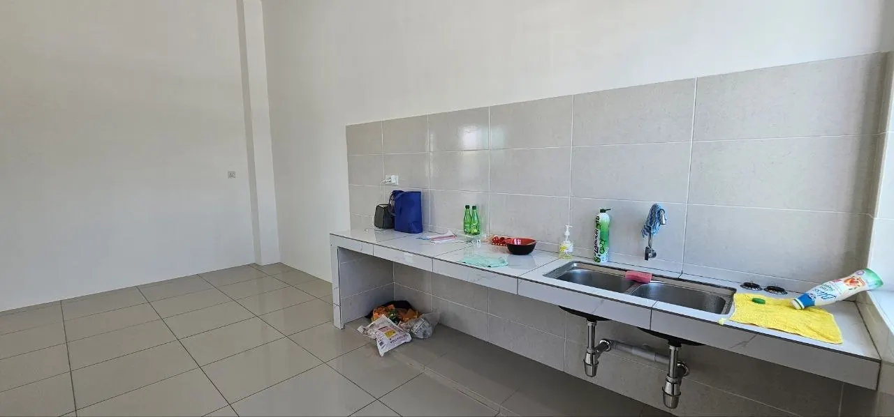 Wet kitchen of the Ampang Cove semi-D with a cast counter and sink