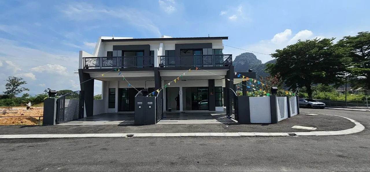 Row of completed Ampang Cove terrace houses seen from the road